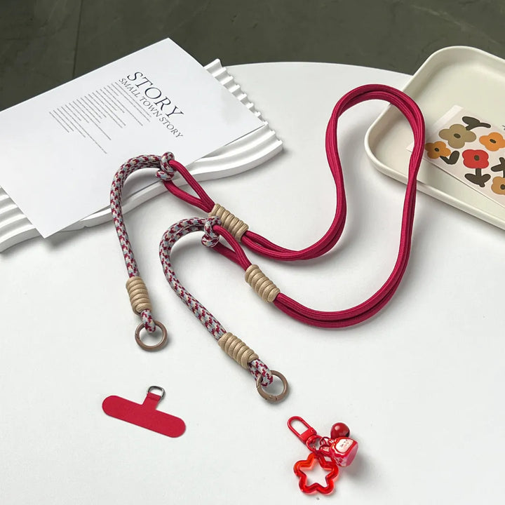 Detachable phone strap structure shown on white background, allowing wrist, neck or crossbody use#color_red