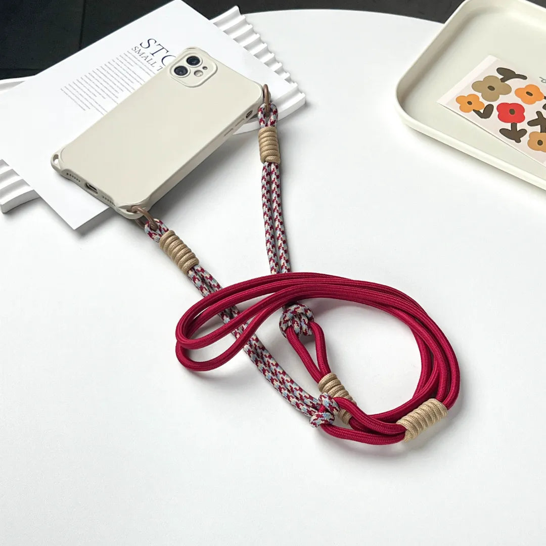 Phone case with strap attached, demonstrating hands free carrying solution for everyday phone protection#color_red