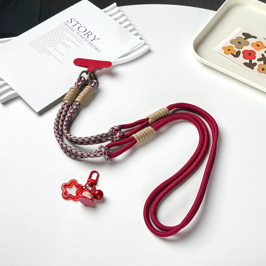 Phone strap connection detail designed to reduce drops and improve phone safety during daily use#color_red