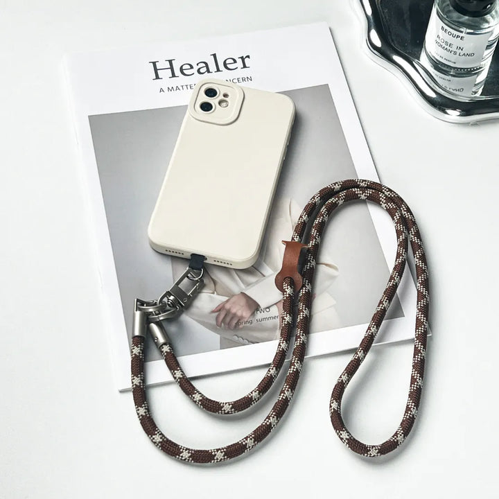 Adjustable brown and white leather phone lanyard leash providing security and modern style#color_brown