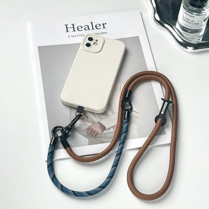 Anti-theft navy blue phone lanyard with a reinforced leather strap for outdoor activities#color_brown