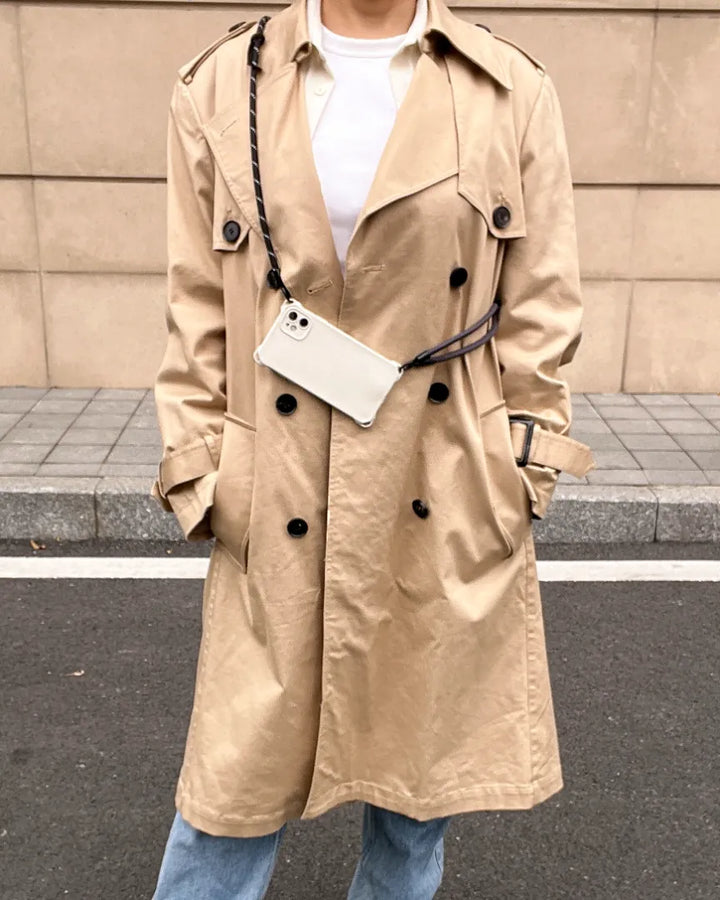 Fashion styling featuring a black crossbody phone strap for a minimalist and functional lookl#color_black