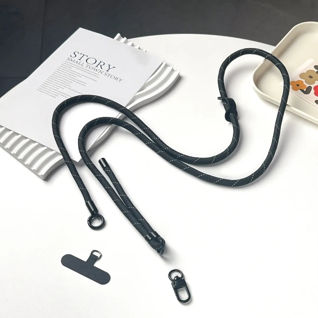 Adjustable black phone strap displayed on white background, showing durable rope texture and clean structure#color_black