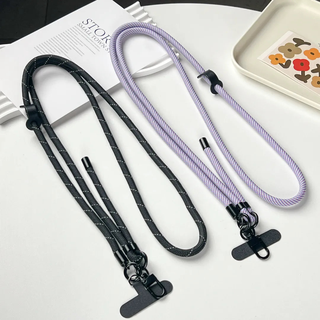 Black phone strap connection detail designed to reduce drops while maintaining a simple and durable build#color_black
