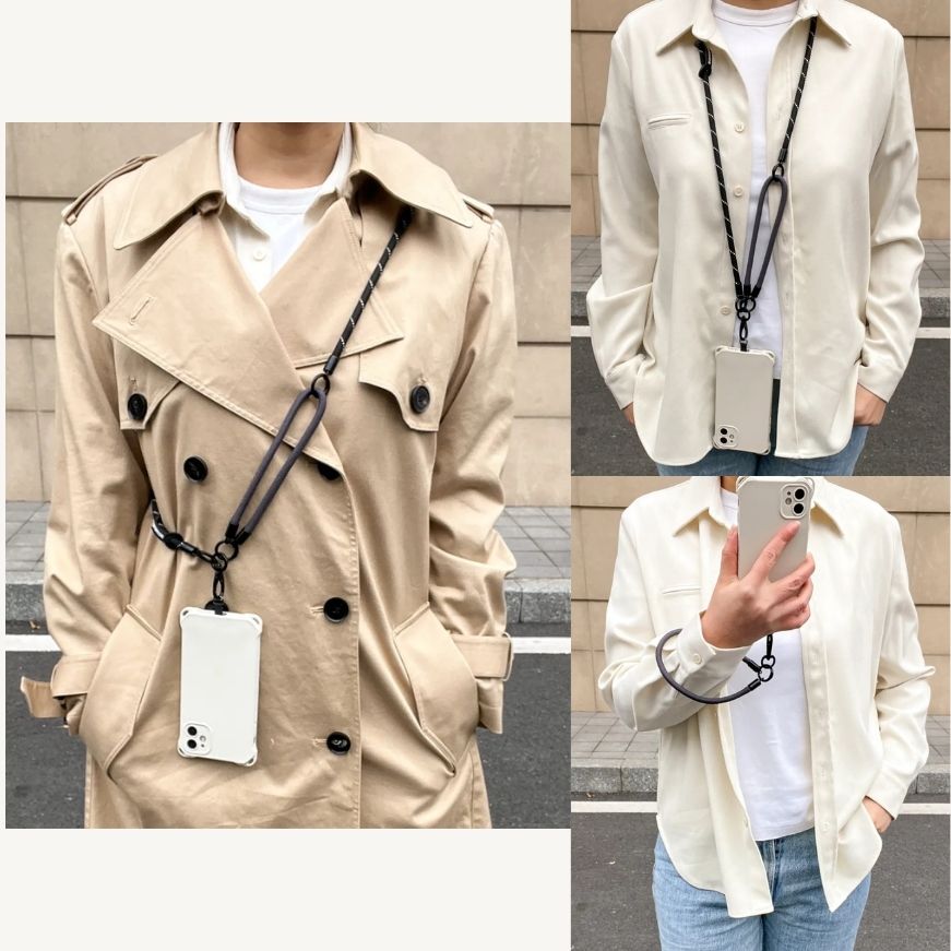 Lifestyle display of a black leather phone strap worn crossbody for a chic urban lookl#color_black