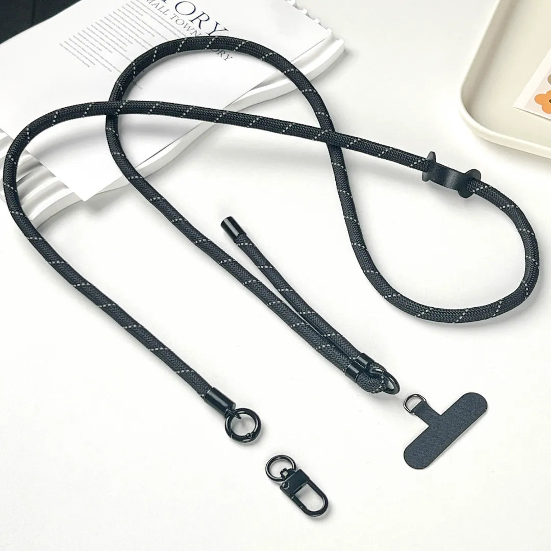 Close up of black phone strap hook connection showing smooth finish and dependable attachment#color_black