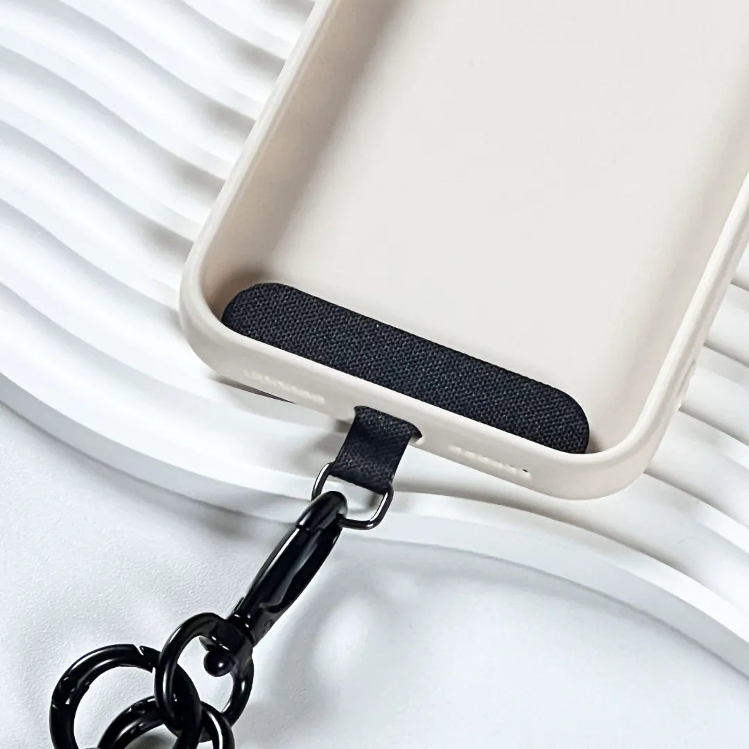 Secure black phone tether tab with a strong metal ring for connecting any phone lanyardl#color_black