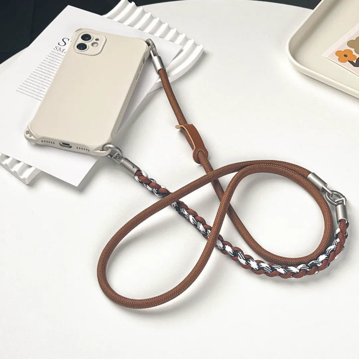Stylish brown braided phone wrist strap designed for secure handheld use and anti-drop safety#color_brown