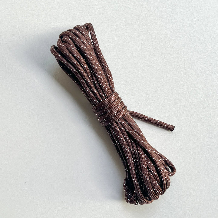 Durable brown flat braided cord made of high-density polyester, compatible with various phone lanyard accessories.