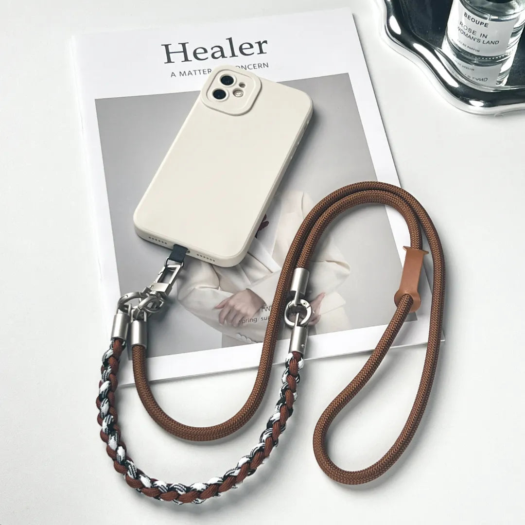 Detachable brown phone strap in a crossbody style featuring a durable leather braided design#color_brown