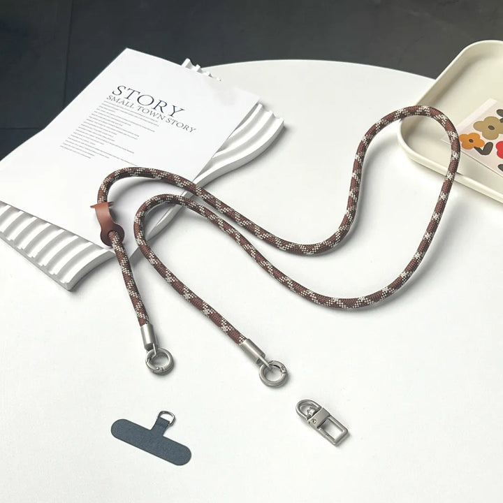 Luxury brown and white braided phone lanyard with premium leather texture and gold hooks#color_brown