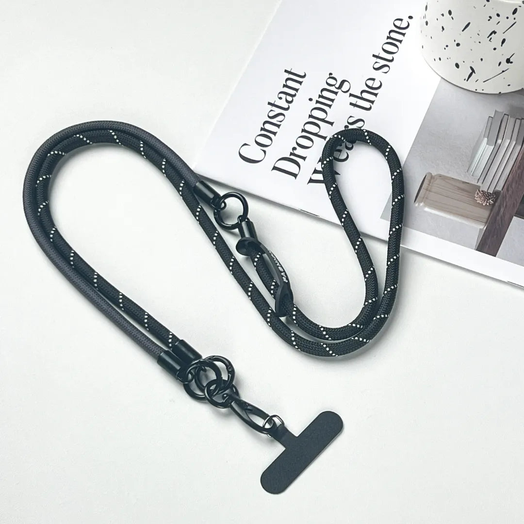 Stealth minimalist black phone lanyard in a crossbody style featuring premium leather weavingl#color_black