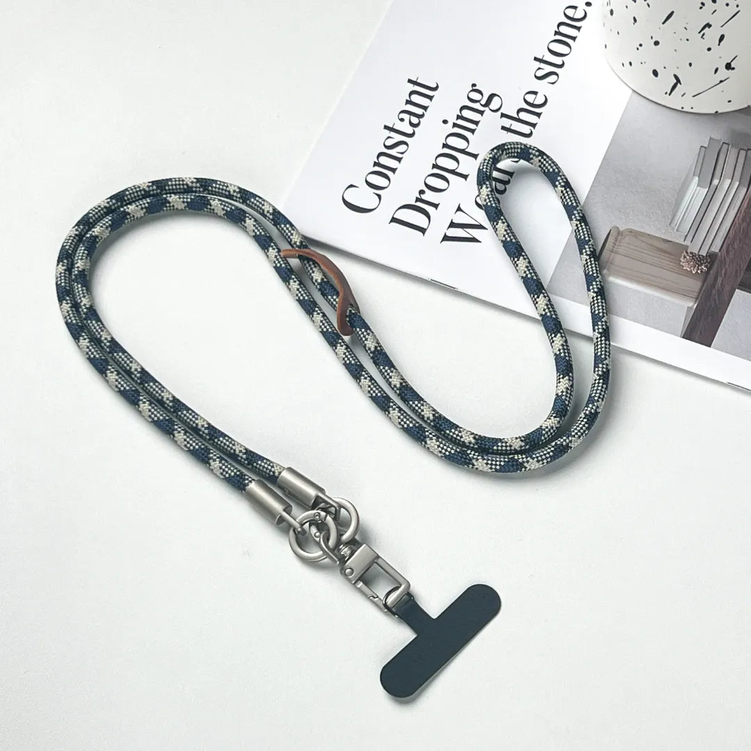 Stylish patterned leather phone lanyard in a crossbody style for a trendy fashion look#color_blue