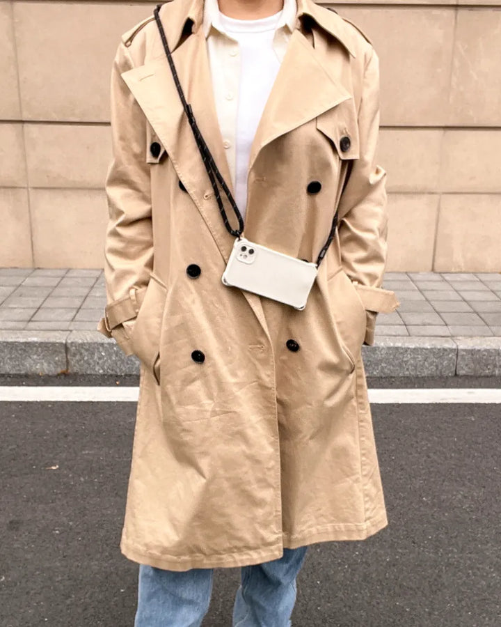 Crossbody phone strap in black tone styled with modern outfit for simple and functional daily use#color_black