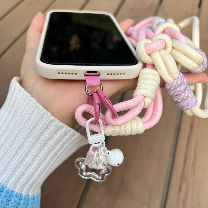 Pink crossbody phone strap shown in hands free daily use, keeping the phone secure while allowing comfortable movement#color_pink