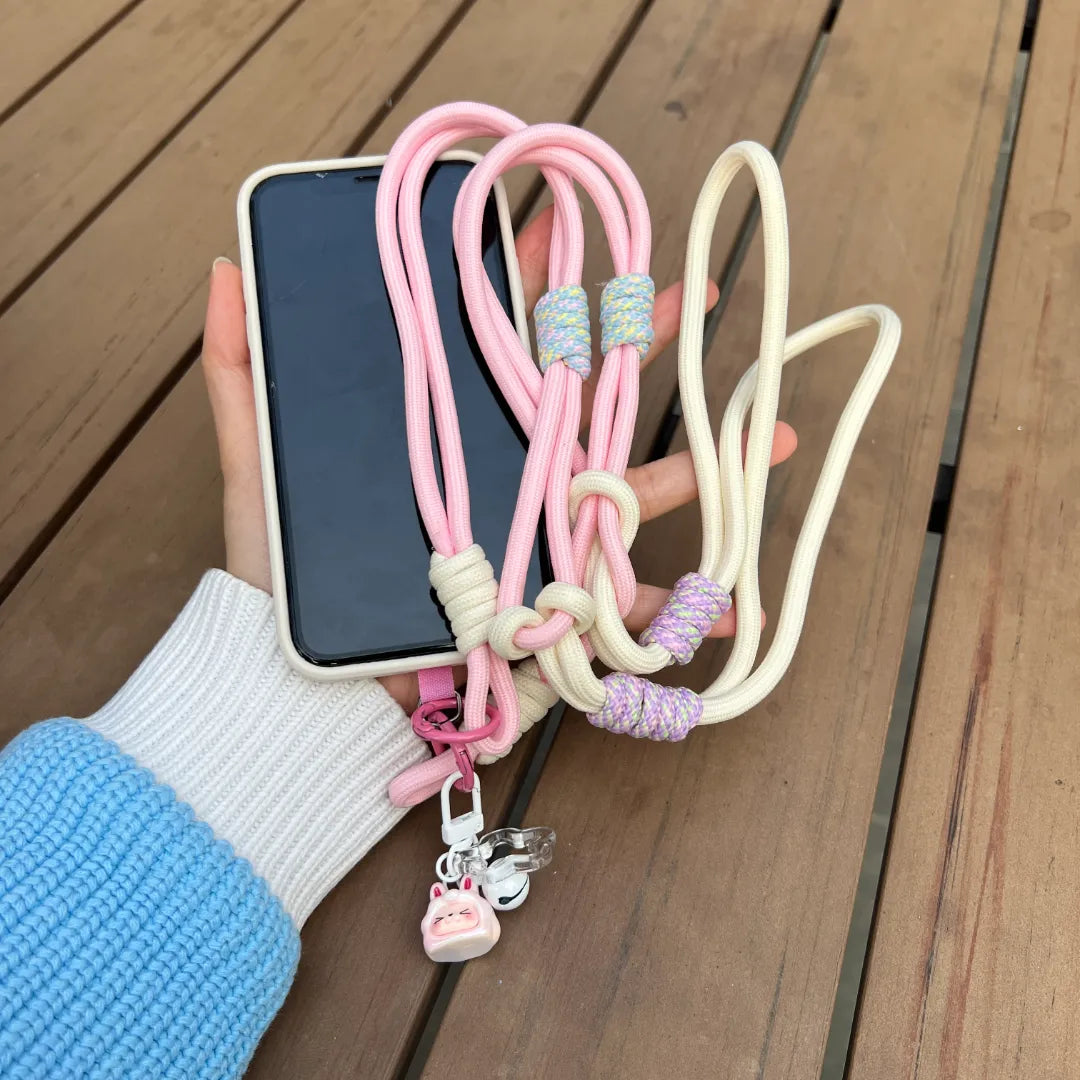 Crossbody phone strap in soft tone styled with modern outfit, offering hands free comfort for daily activities#color_pink