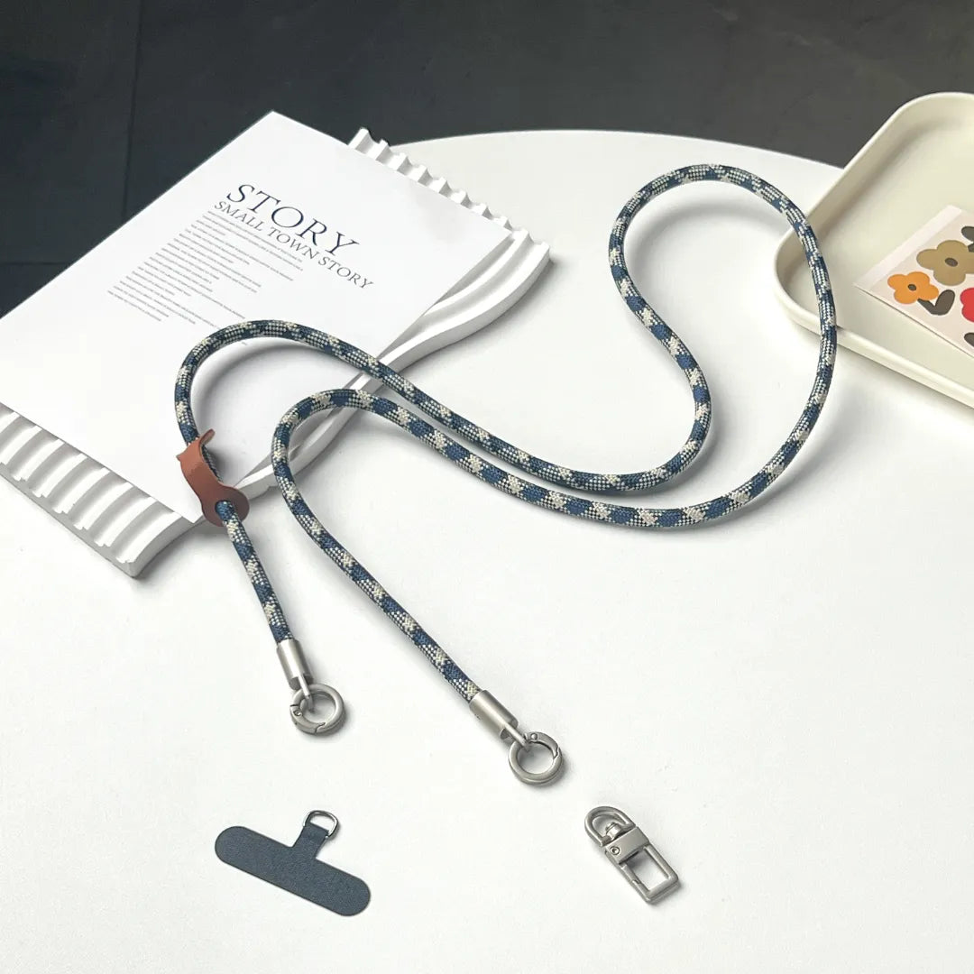 Unique grey and blue patterned braided leather phone strap with gold lobster hooks#color_blue