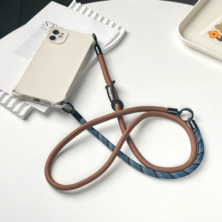 Luxury navy blue leather phone wristlet accessory perfect for a minimalist and modern style#color_brown