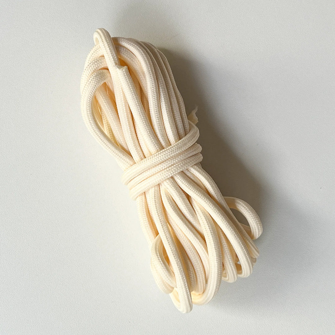 Natural white macrame cord made of high-quality cotton yarn, ideal for eco-friendly handmade weaving projects.