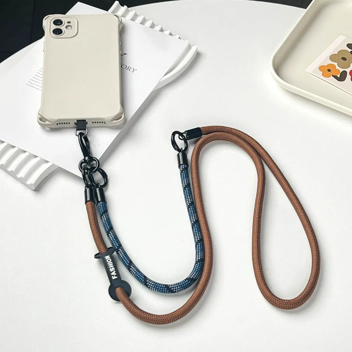 Exquisite navy blue phone charm strap featuring a high quality braided leather design#color_brown