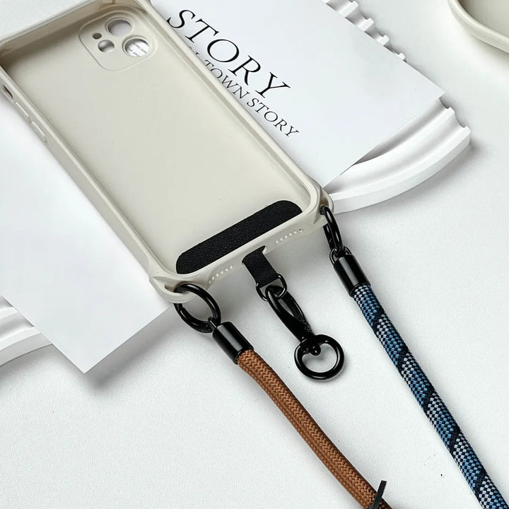 Stylish navy blue phone wrist strap made of braided leather for secure hand-carrying#color_brown