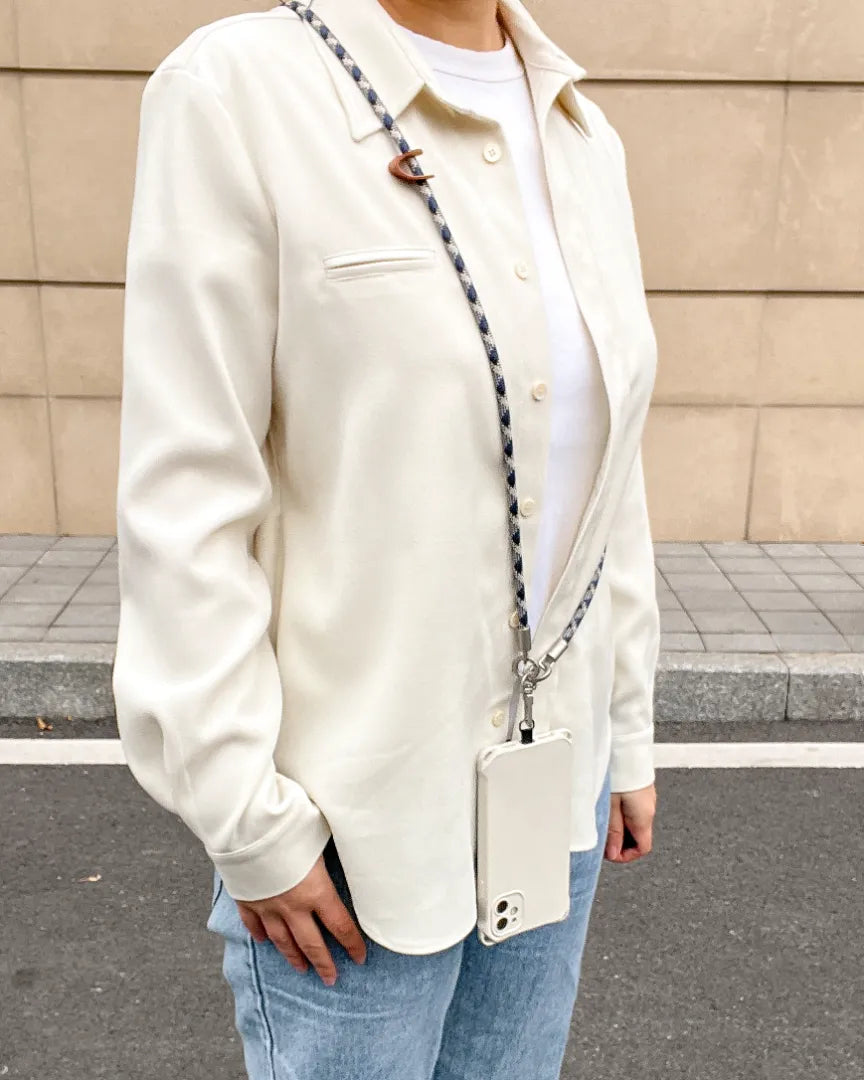 Elegant look featuring a patterned crossbody phone strap for modern urban lifestyle#color_blue