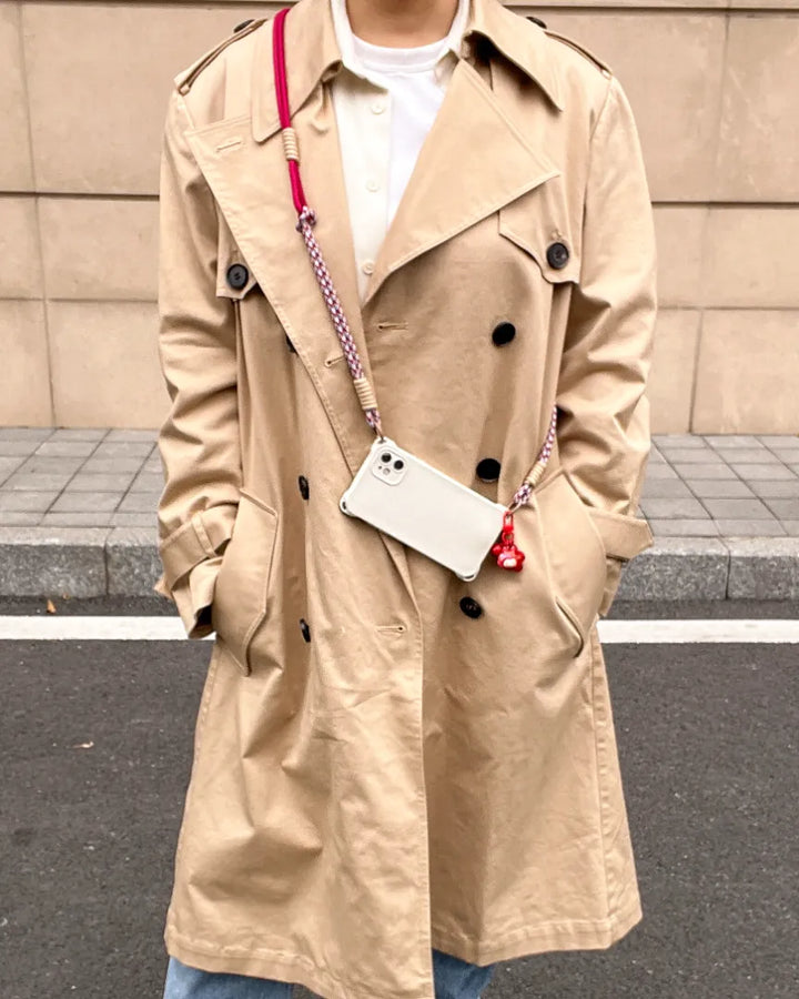 Phone lanyard worn as a fashion accessory, providing secure phone holding without affecting outfit style#color_red