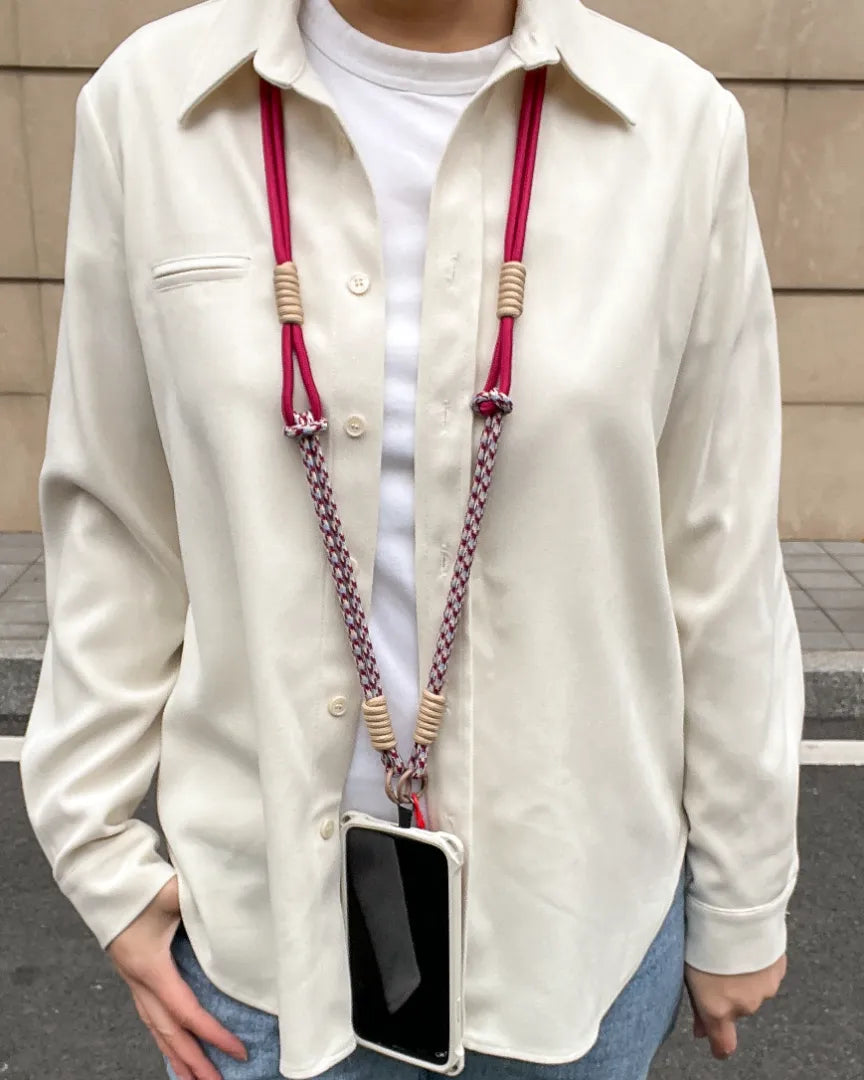 Phone strap worn with casual clothing, highlighting lightweight design and comfortable daily phone use#color_red