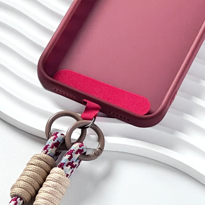Detachable charm phone strap design shown clearly, allowing decorative and functional customization#color_red