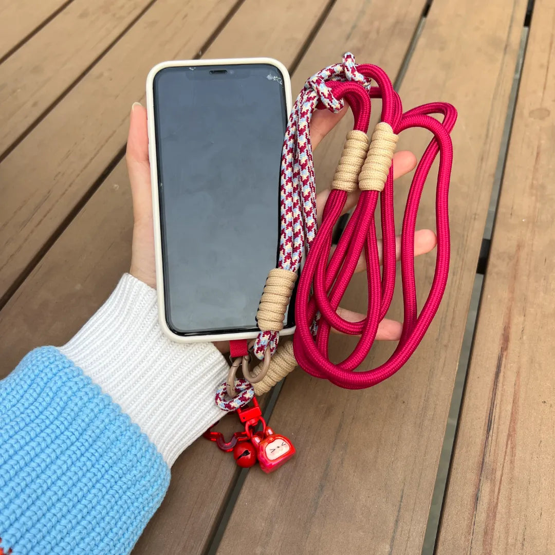 Phone wrist strap displayed in one hand use, helping prevent drops while offering comfortable everyday handling#color_red