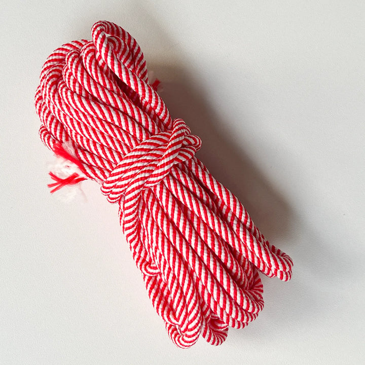 Pastel pink macrame cord made of natural cotton, ideal for delicate wall hanging weaving and bohemian style crafts.