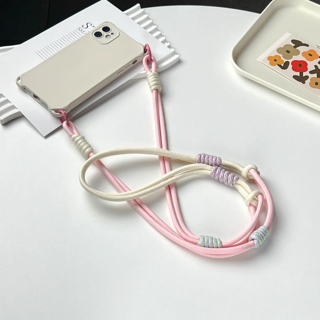 Pink phone strap connection detail designed to reduce drops while maintaining a lightweight structure#color_pink