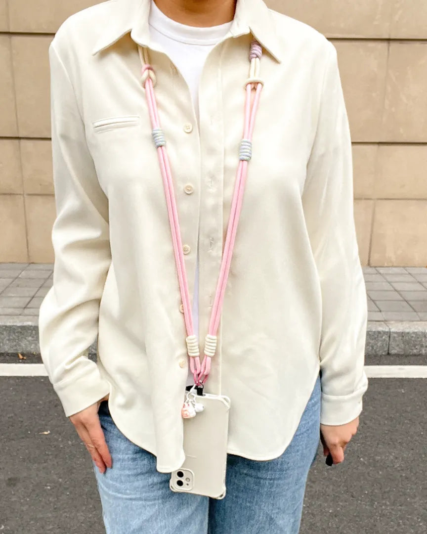 Pink phone strap paired with casual clothing, showing lightweight design and relaxed daily fashion use#color_pink