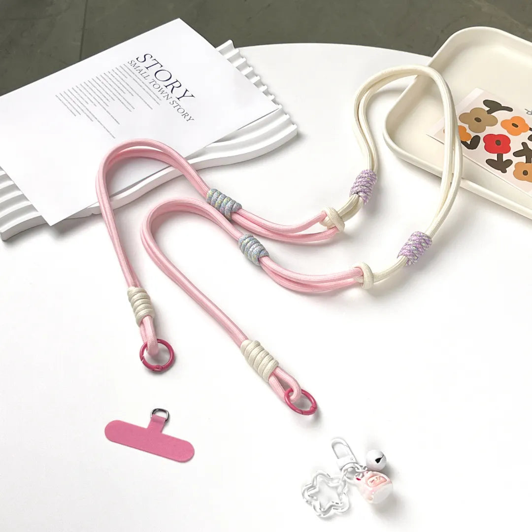 Detachable pink phone strap structure shown clearly, allowing wrist, neck or crossbody wearing styles#color_pink