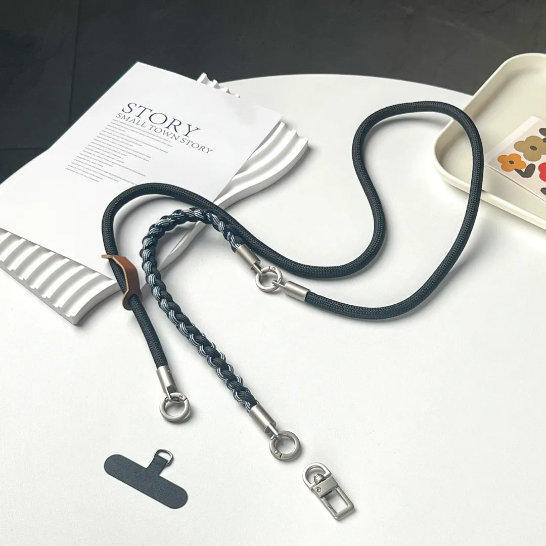 Adjustable rugged phone strap displayed on white background, showing thicker rope texture and durable construction#color_black