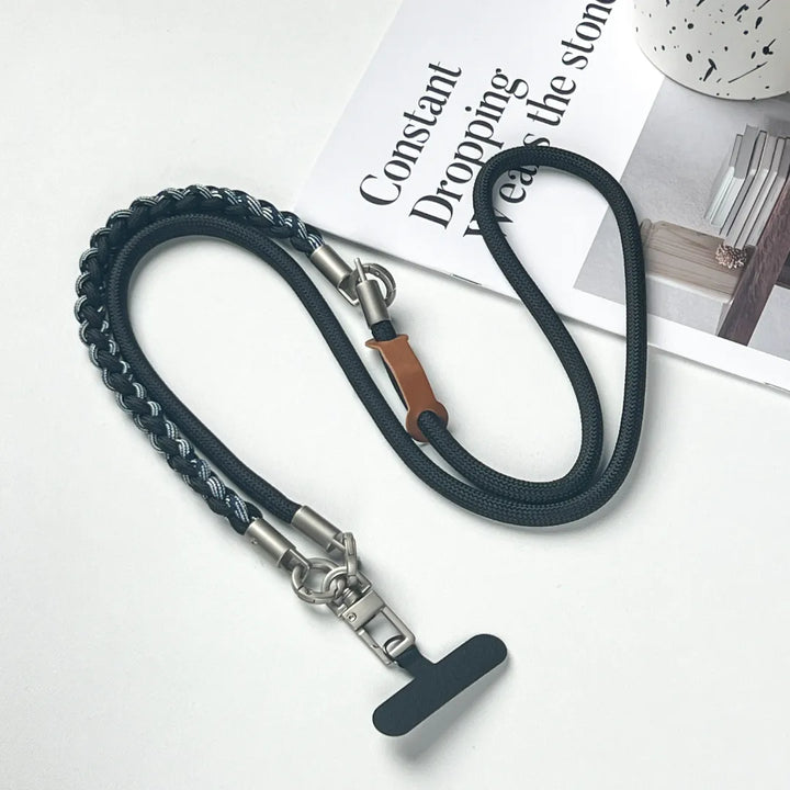 Detachable rugged phone strap structure shown clearly, allowing wrist, neck or crossbody wearing styles#color_black