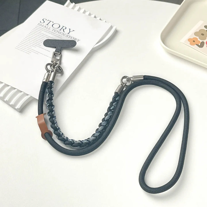 Dual tone rugged phone strap displayed on white background, highlighting black and brown rope combination#color_black