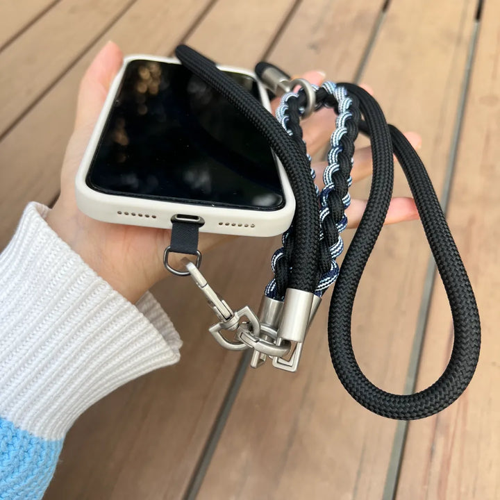 Rugged phone strap shown in hands free daily use, keeping the phone secure during movement and active situations#color_black