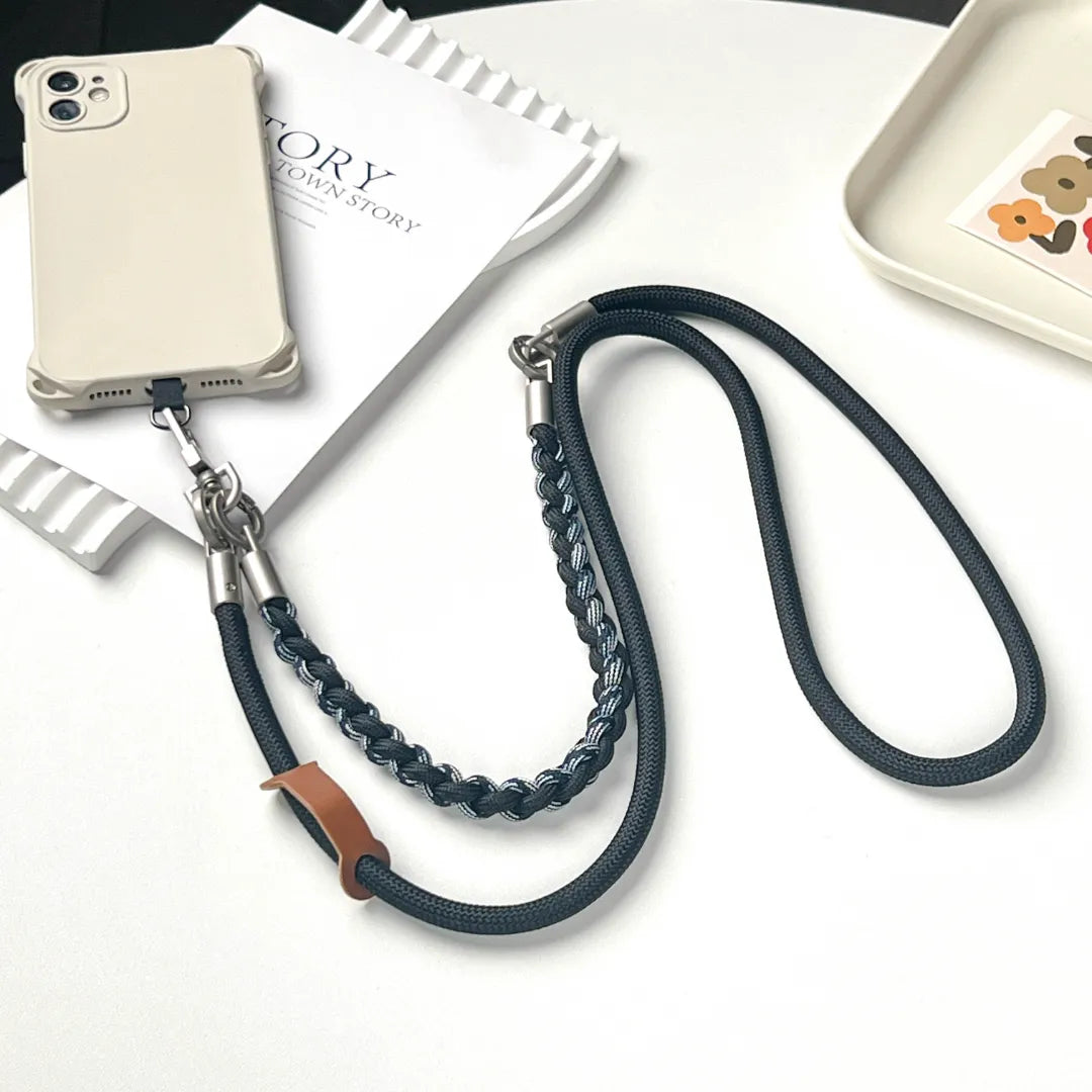 Close up view of rugged phone strap thick rope detail showing strength and wear resistant material#color_black
