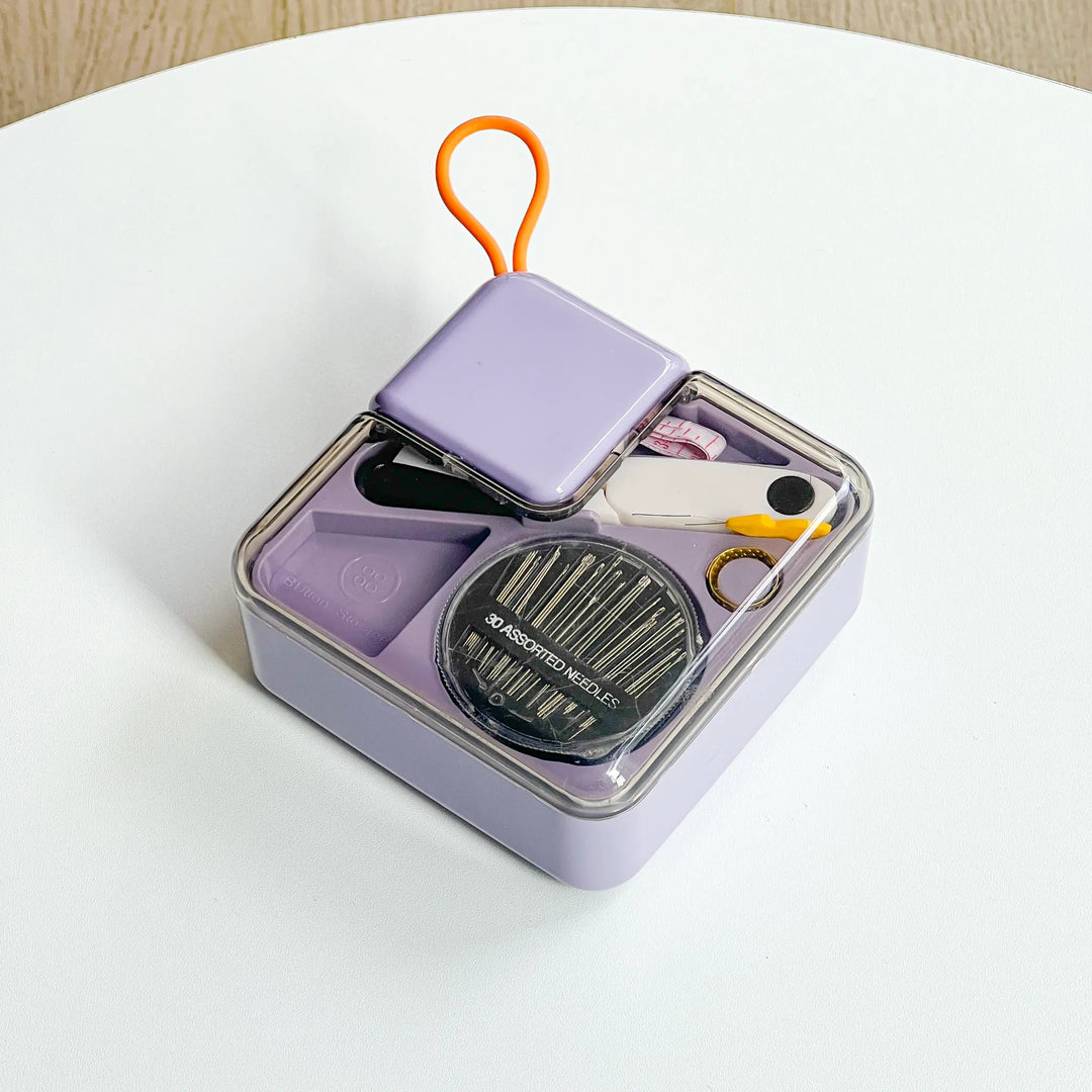 Compact metal sewing storage tin box containing essential tools for a hands-free and organized crafting experience.