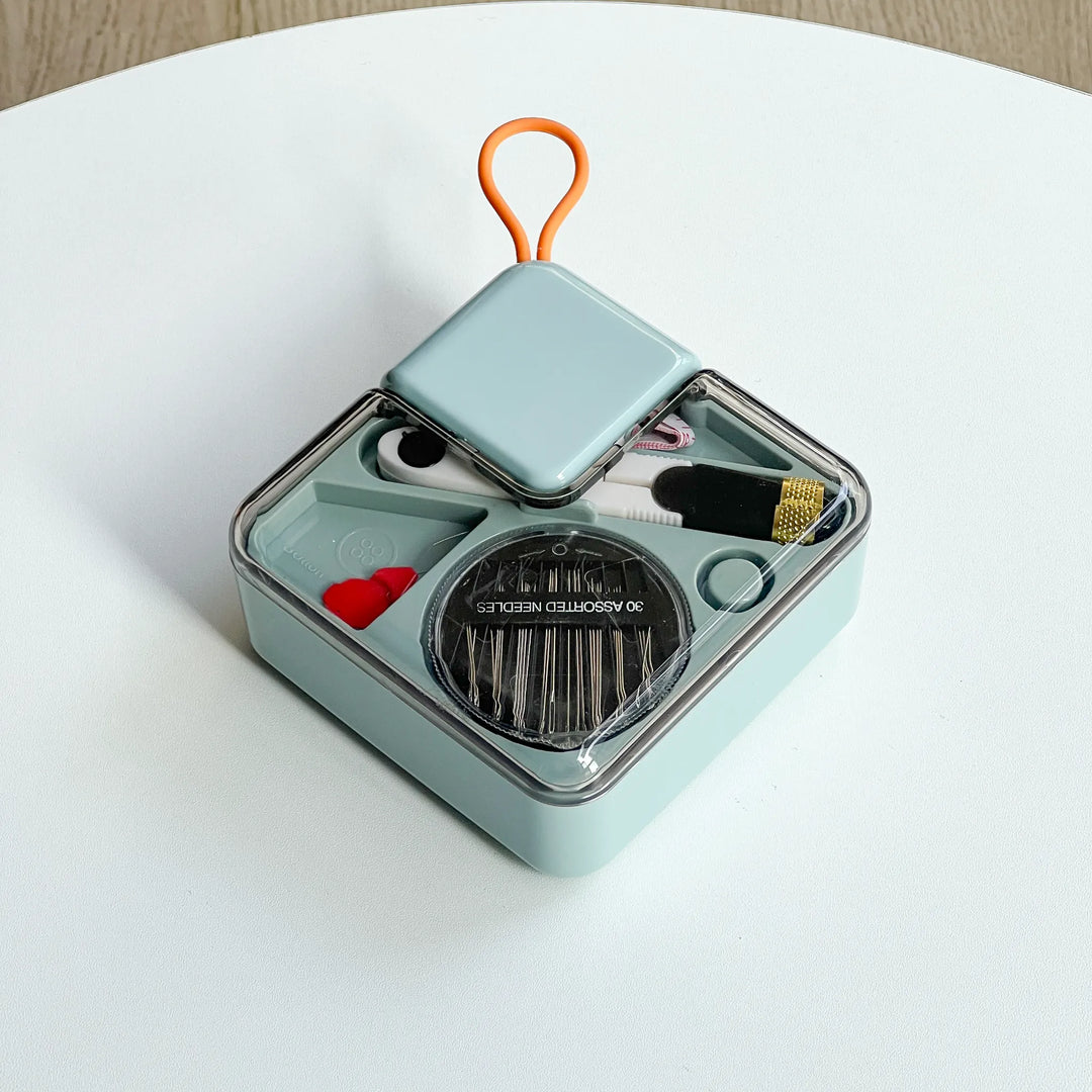 Close-up of a closed sewing tin lid showing its sleek and portable design, easy to fit into any handbag or travel luggage.