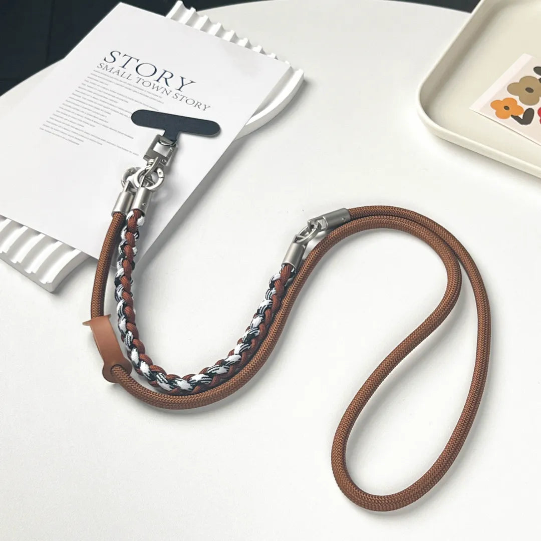 Short brown phone charm strap made of braided leather for a fashionable wrist carry option#color_brown