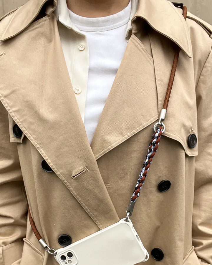 Versatile smartphone lanyard strap in brown leather providing a chic crossbody carrying solution#color_brown