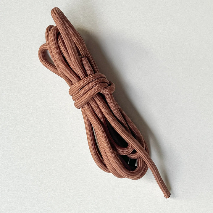 Terracotta brown braided cord for creative mending and weaving, skin-friendly material for comfortable DIY crafts.