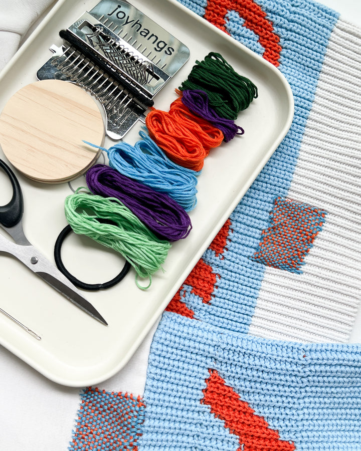 Using weaving loom to repair holes in socks and clothing fabric