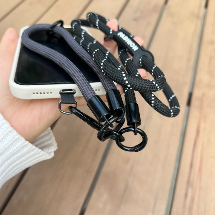 Anti-drop protection provided by a sturdy black braided leather wrist phone strapl#color_black